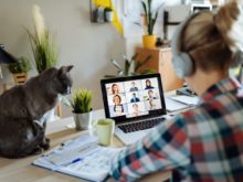 Woman has virtual meeting on laptop